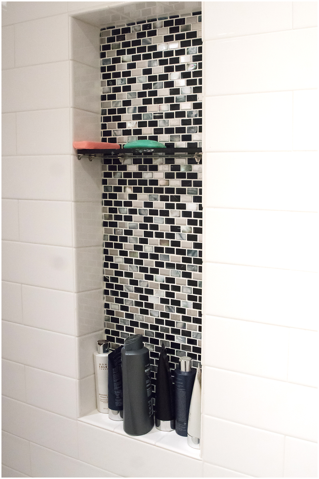 The tile shower in this luxury master bathroom features a stunning custom tile backsplash Custom Bathroom Tile